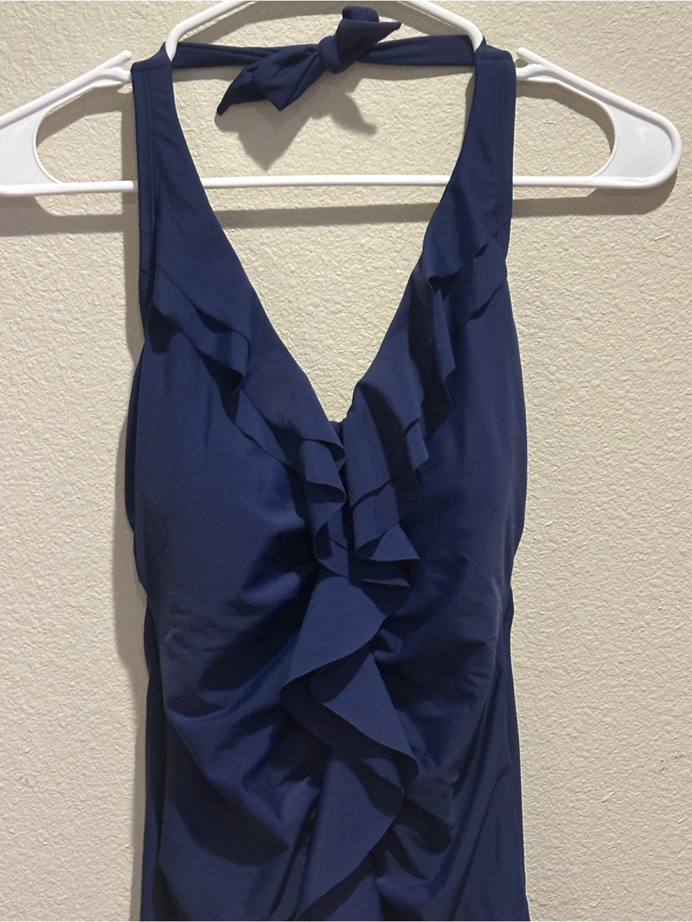 Merino Brand - Navy Blue One piece Swimsuit with front ruffle. Ties at the neck.